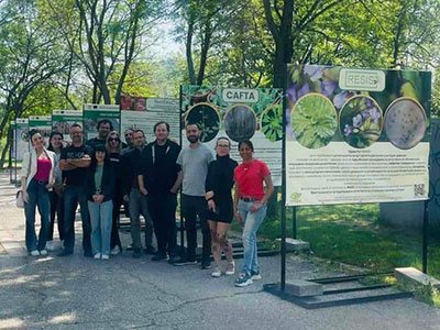 Visitors in front of the RESIST billboards in Alexander Panov Alley